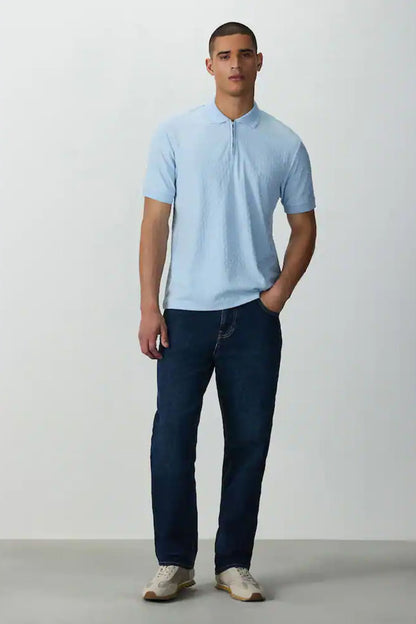 Light blue polo shirt with short sleeves, collar, and button placket