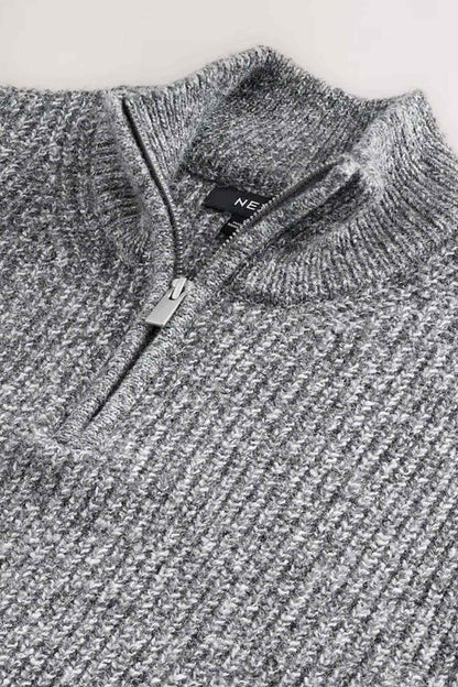 Grey knit half-zip sweater close-up of zipper and inner neck label