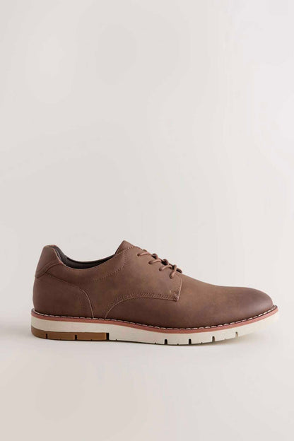 Tan brown lace-up oxford shoe with cushioned collar and white rubber sole
