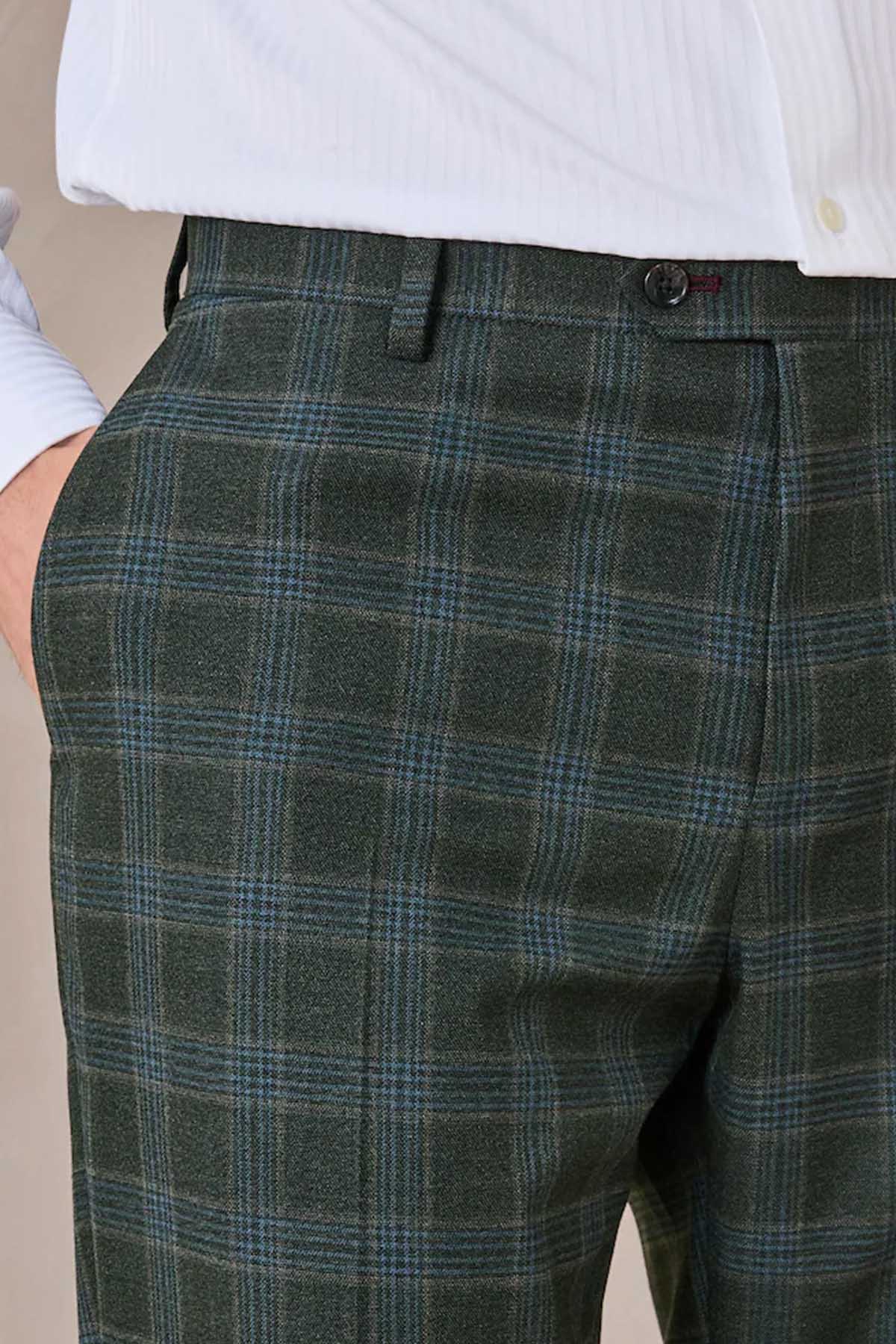 Green plaid suit trousers close-up of waistband and front crease