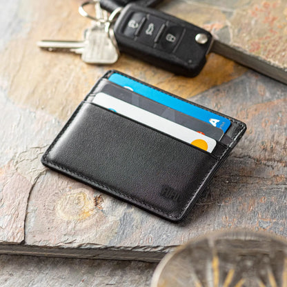 Black leather-style card wallet with snap button and multiple card slots
