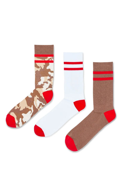 Three crew socks: camo with red band, white with red stripes, brown with red tips