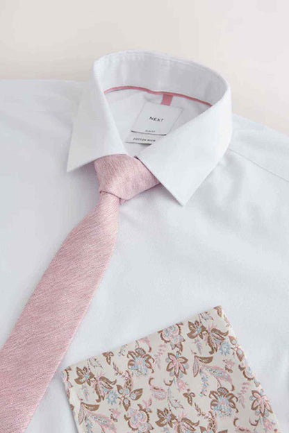 White dress shirt collar with pink tie and floral pocket square