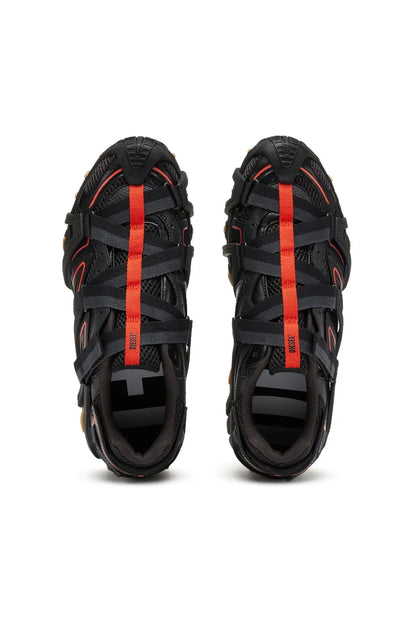 Black sneakers with red vertical stripe, lace-up closure, and textured uppers