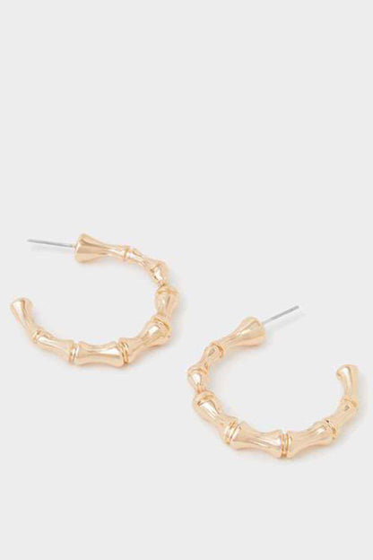 Gold bamboo hoop earrings with textured bar links, visible posts