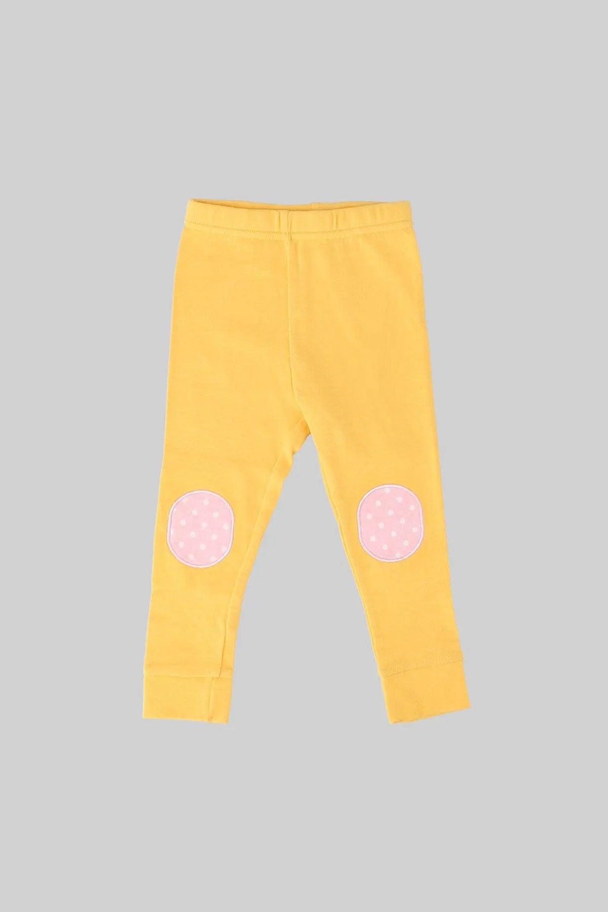 Baby pajama pants in yellow with pink dotted knee patches