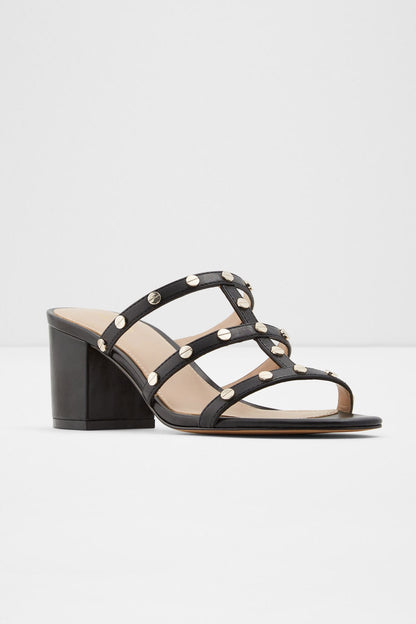 Black studded heeled sandals with open toe straps and round metal rivets, block heel