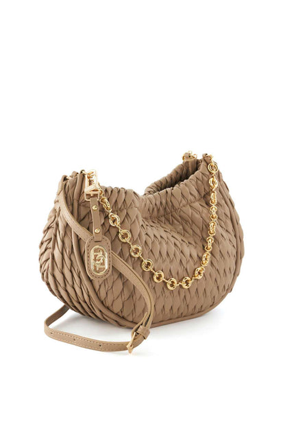 Taupe quilted hobo bag with gold chain, front logo charm, and wrist strap