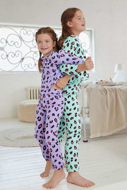 Kids' long-sleeve pajama set in purple and mint leopard print, matching pants