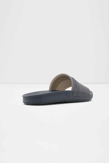 ALDO dark blue slide sandal, side view with textured footbed