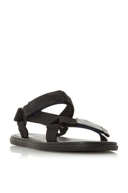 Black flat sandals with two wide straps and back ankle strap, buckle closure