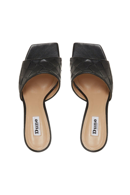 Black quilted leather mule sandals with open toe and slingback heel opening