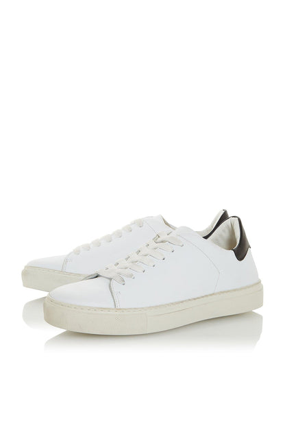 White low-top sneakers with lace-up front and thick white sole, angled view