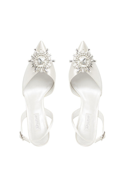 Ivory heeled sandals pair with pointed toe and crystal cluster embellishment