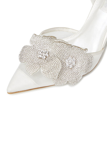 Ivory pointed-toe slingback heel with crystal floral ornament on strap