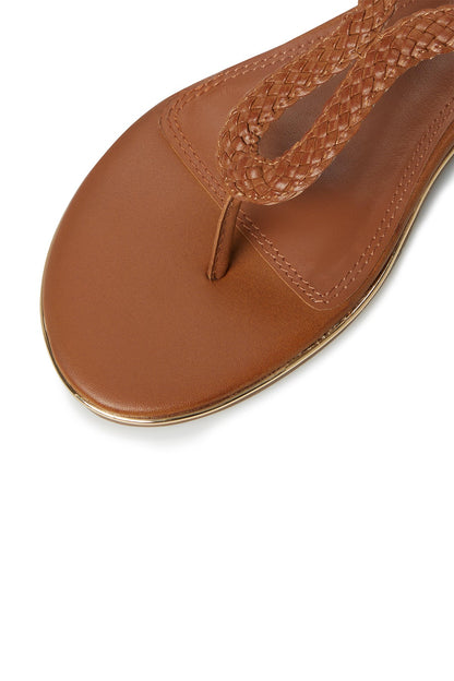 Tan leather sandal with stitched thong toe and braided strap detail