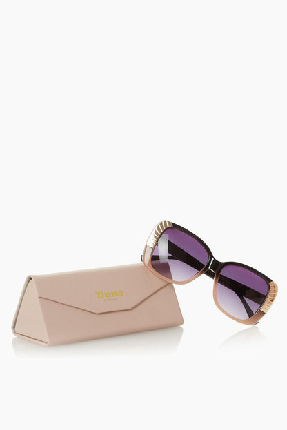 Blush square sunglasses with purple lenses beside matching beige case