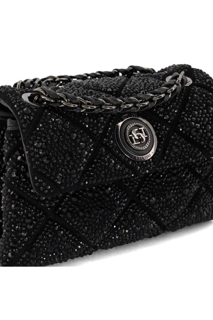 Black glitter quilted shoulder bag close-up with logo flap and chain detail