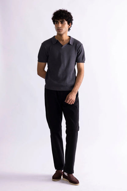 Men's dark gray polo shirt with short sleeves and collar, front standing pose