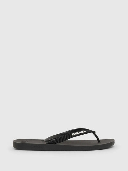 Black flip-flops with Diesel logo strap, thong style sandal