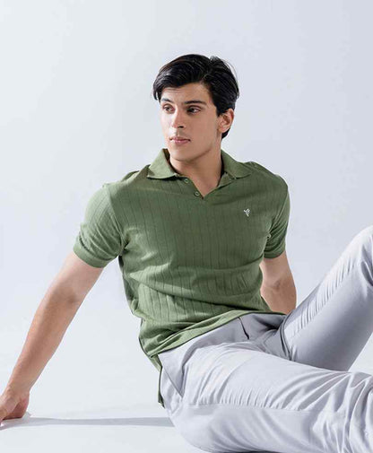 Fitted green ribbed polo shirt with short sleeves and collar, small chest logo