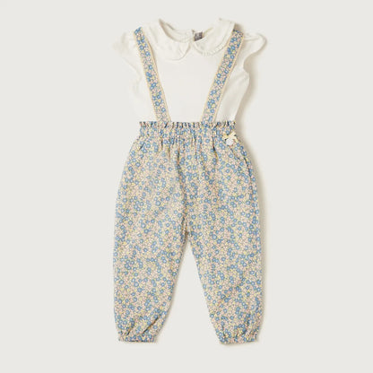 Cream-and-blue floral baby romper with white top and blue suspender overalls