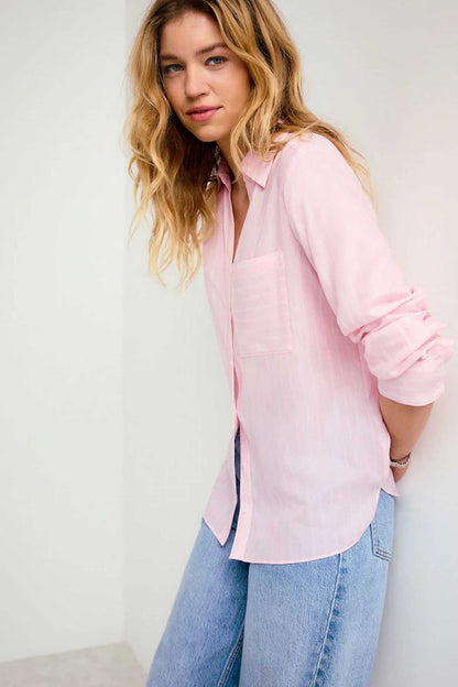 Pink button-up shirt with split hem and long sleeves