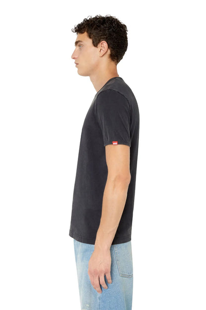 Black Diesel T-shirt on model, side view, short sleeves