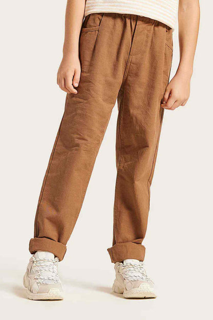 Brown cotton jogger pants with cuffs and stitched seams, kids