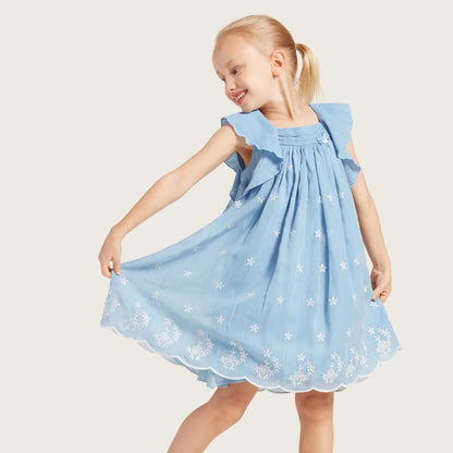 Blue baby dress with star print, ruffled flutter sleeves, gathered skirt, scalloped hem