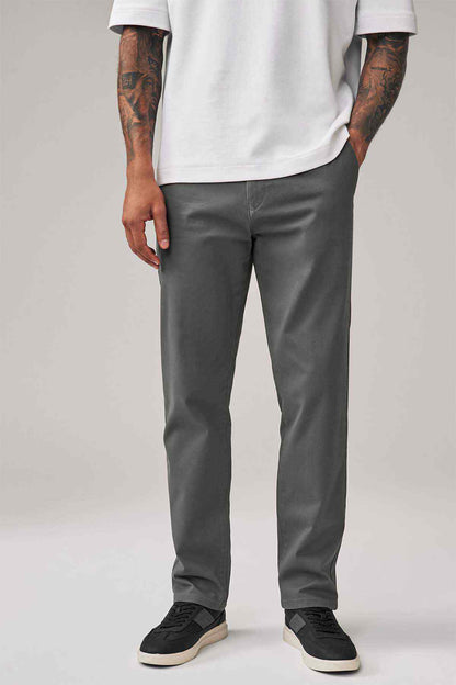 Dark grey straight-leg trousers showing front crease and ankle-length hem