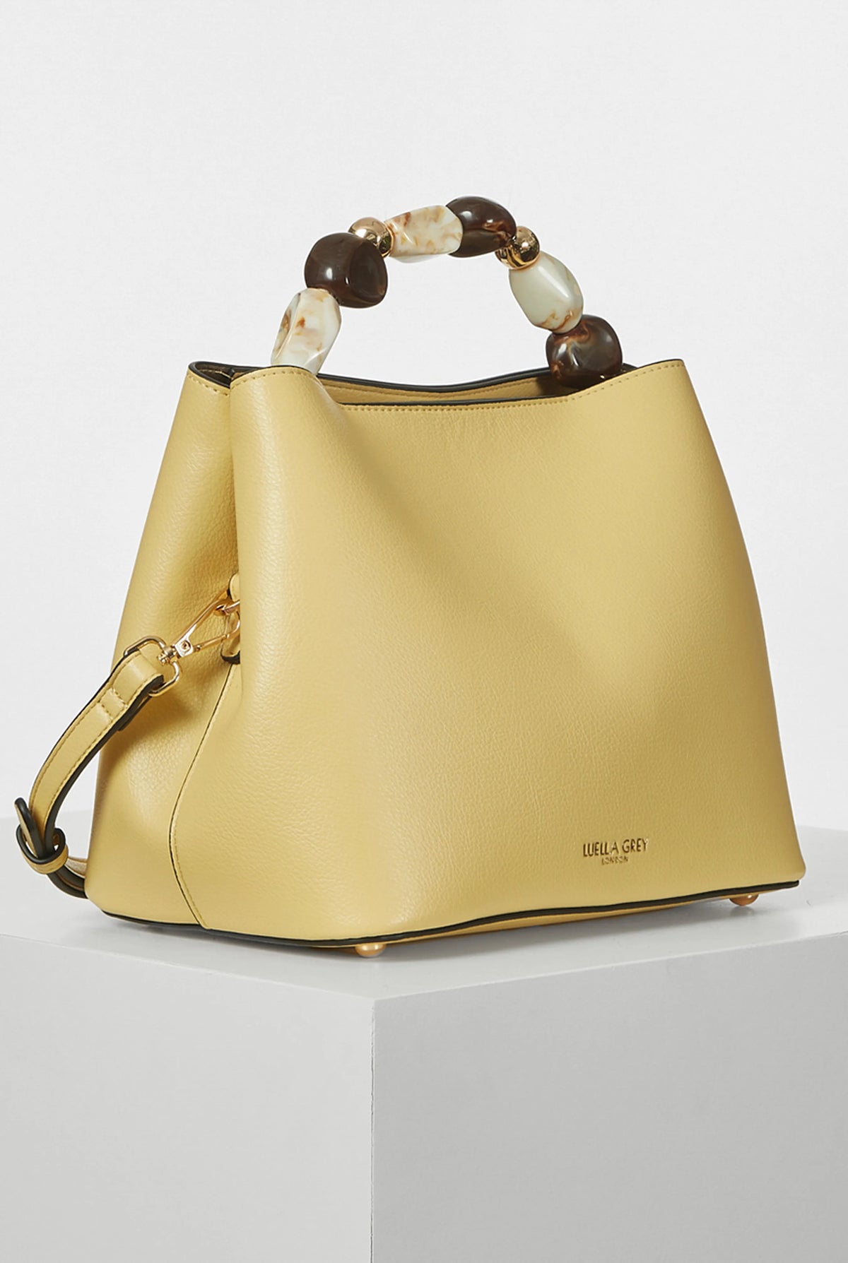 Yellow hobo handbag with tortoiseshell beaded top handle and detachable shoulder strap