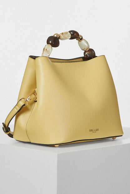 Yellow hobo handbag with tortoiseshell beaded top handle and detachable shoulder strap