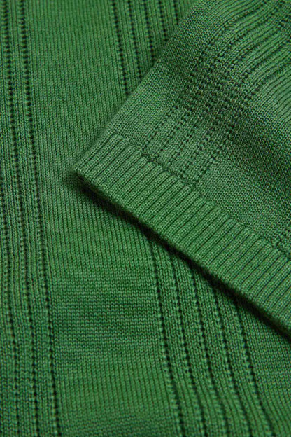 Green knit polo sleeve with ribbed texture and stitched seam