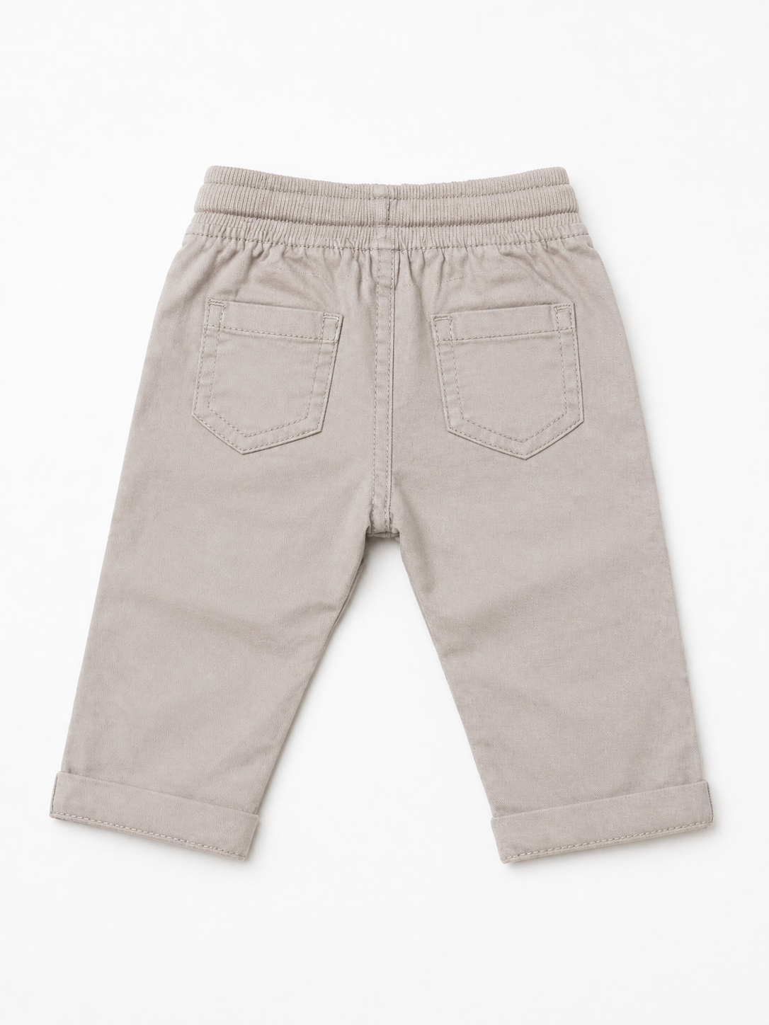 Beige baby pants with elastic waist and stitched back patch pockets, drawstring at center