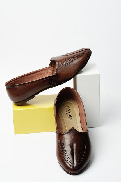 Brown leather slip-on loafers with open top showing tan insole