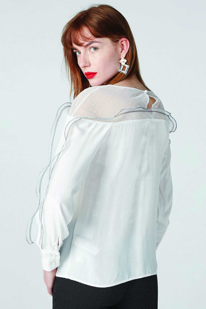 White sheer blouse with ruffled back yoke and long sleeves