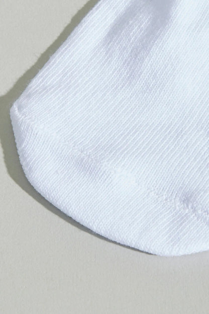 White baby sock close-up with ribbed knit cuff