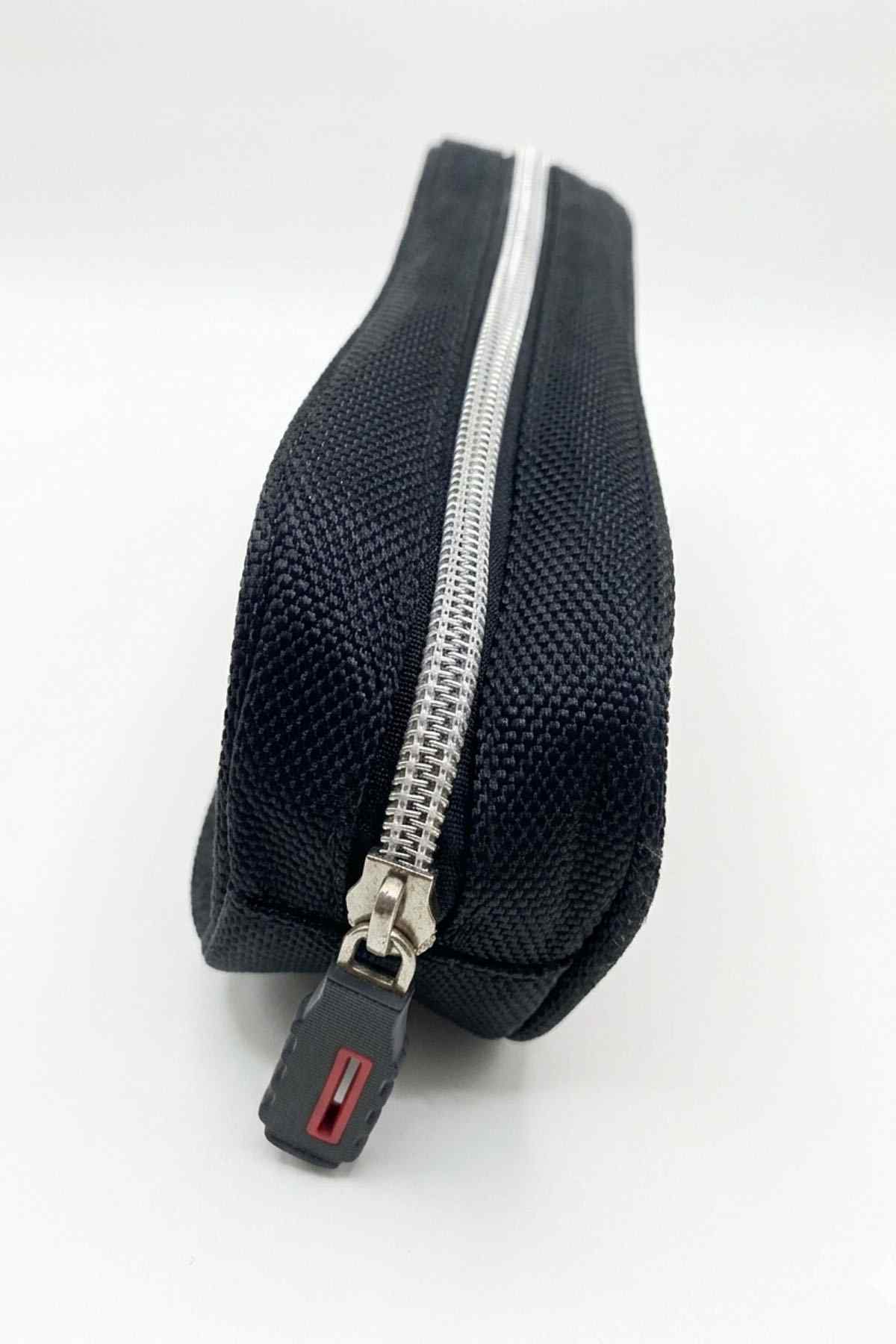 Navy textured pencil case with silver zipper and red pull tab