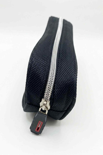 Navy textured pencil case with silver zipper and red pull tab