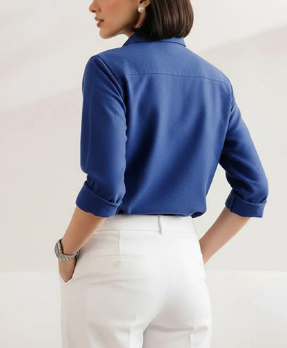 Blue fitted button-up shirt with back yoke and stand collar