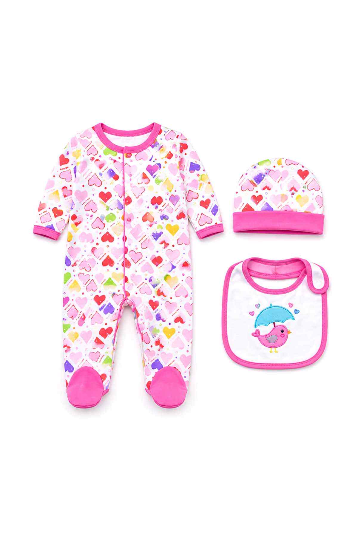 Flat lay: pink heart-print footed sleeper with matching cap and pink-trim bib