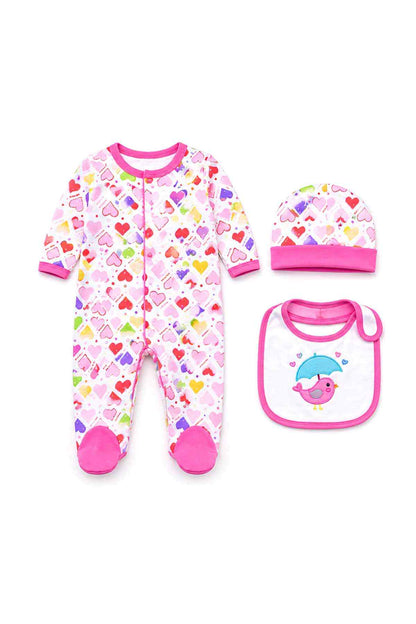 Flat lay: pink heart-print footed sleeper with matching cap and pink-trim bib