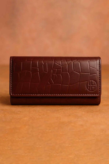 Burgundy leather long wallet with embossed tile pattern and logo emblem
