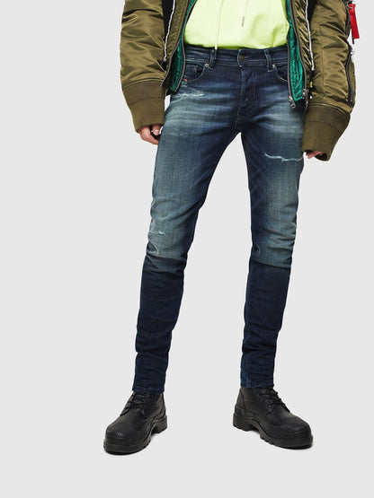 Diesel indigo denim jeans with slim fit, whiskering and ripped knee detailing
