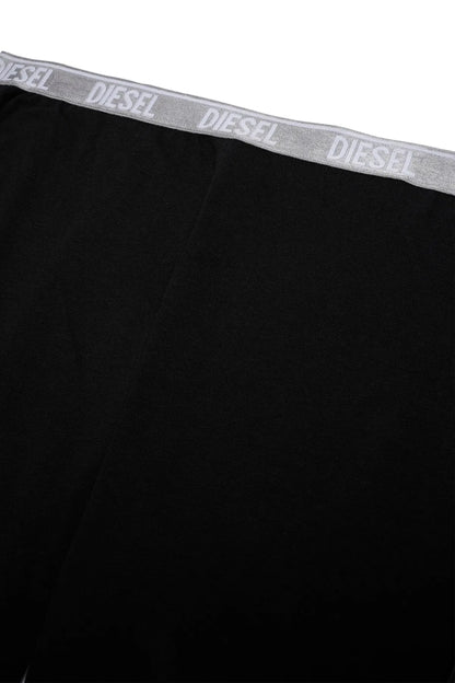Diesel waistband on black sweatpants, close-up of logo text elastic band