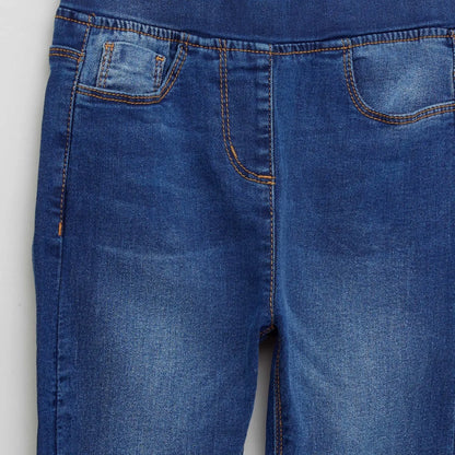 BABYSHOP blue denim jeans close-up: front pocket and orange stitch detail