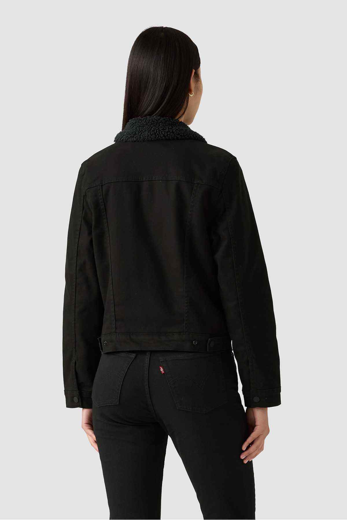Black denim jacket back view with high textured collar and buttoned cuffs