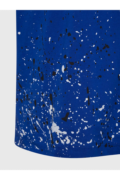 Blue Diesel T-shirt hem with dense white paint splatter pattern