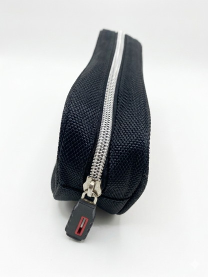 Navy pencil case angled view with silver zipper and red pull tab